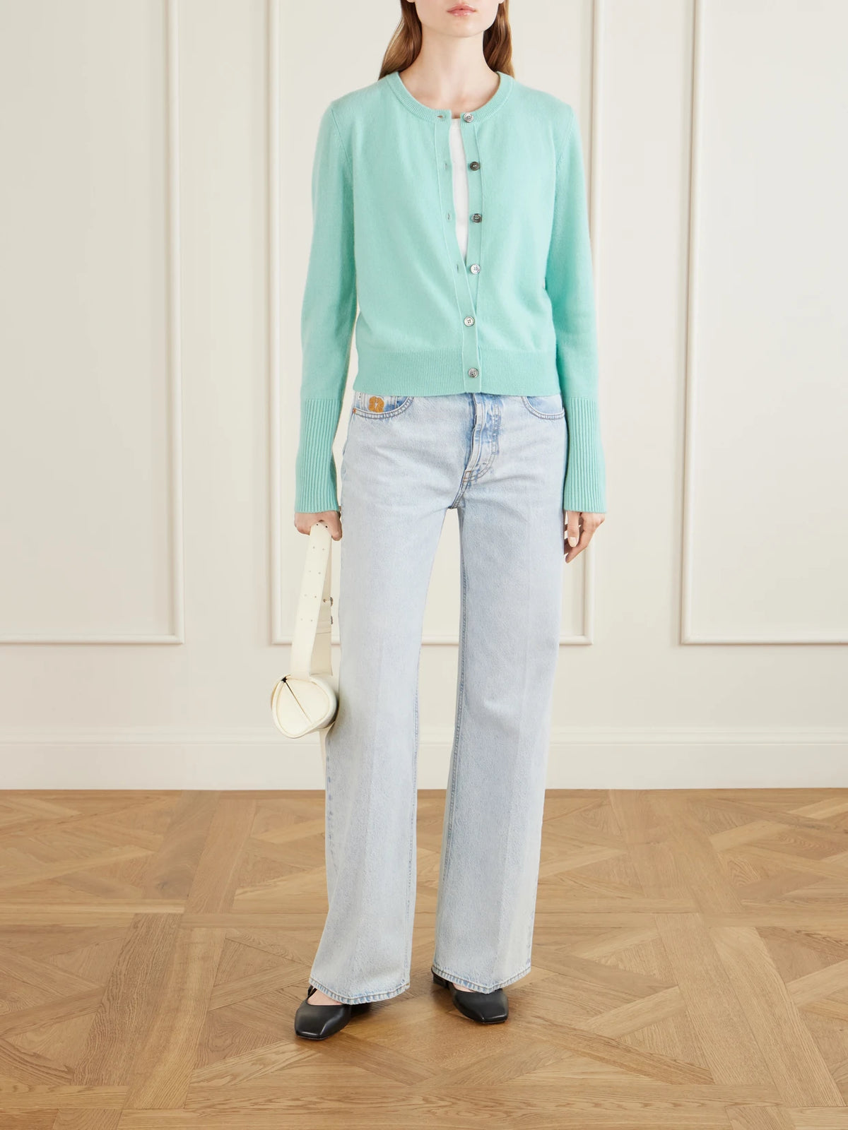 Image of a model wearing Outerwear. Product name - Cashmere Cardigan in Light blue colour by brand - La Ligne