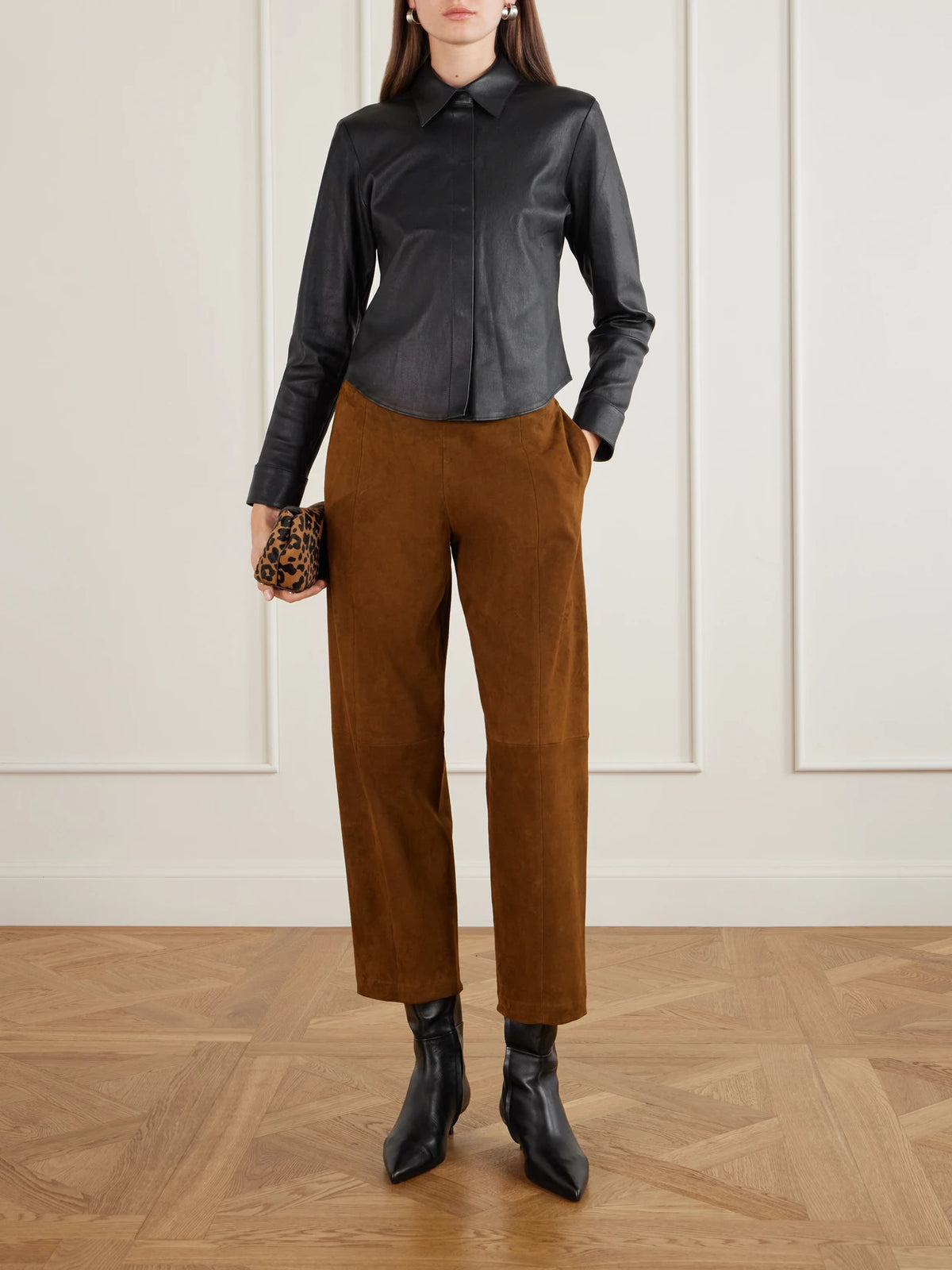 Image of a model wearing Tops. Product name - Alba Leather Shirt in Black colour by brand - STOULS