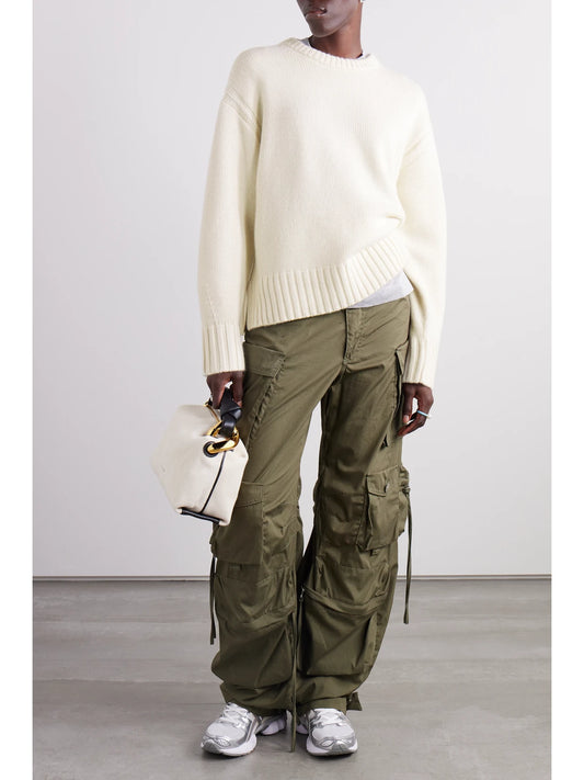 Image of a model wearing Outerwear. Product name - Cashmere Sweater in Cream colour by brand - Guest In Residence
