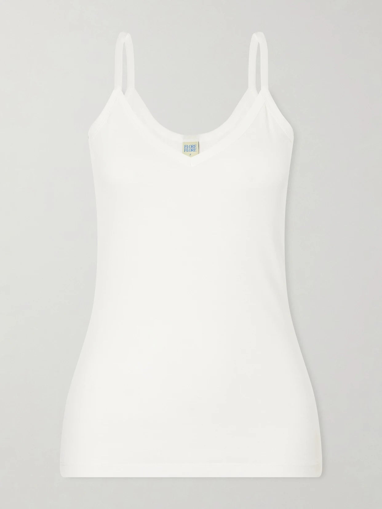 Image of a model wearing Tops. Product name - Isla Organic Cotton-jersey Camisole in White colour by brand - FLORE FLORE