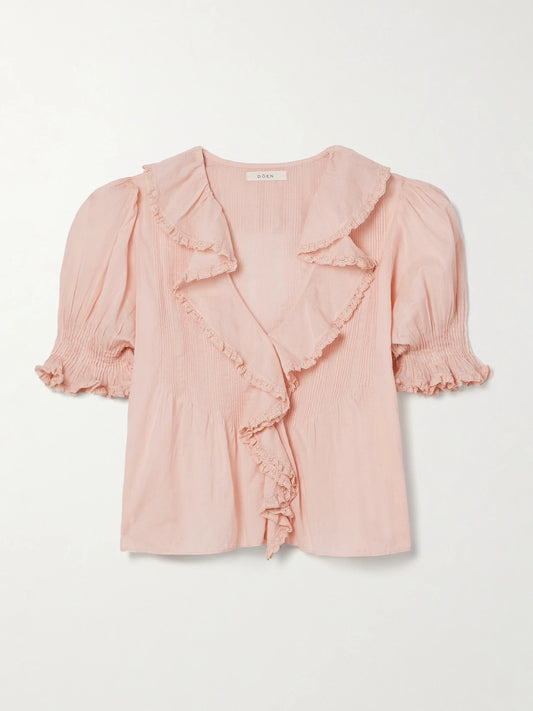 Image of a model wearing Tops. Product name - Henri Lace-trimmed Ruffled Pintucked Organic Cotton-voile Blouse in Blush colour by brand - DÔEN