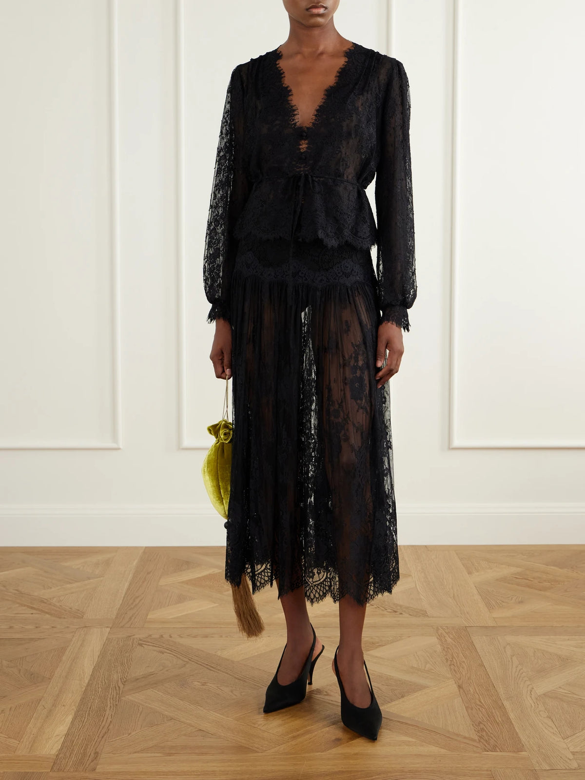 Image of a model wearing Tops. Product name - Amaline Lace Blouse in Black colour by brand - DÔEN