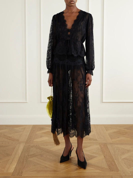 Image of a model wearing Tops. Product name - Amaline Lace Blouse in Black colour by brand - DÔEN