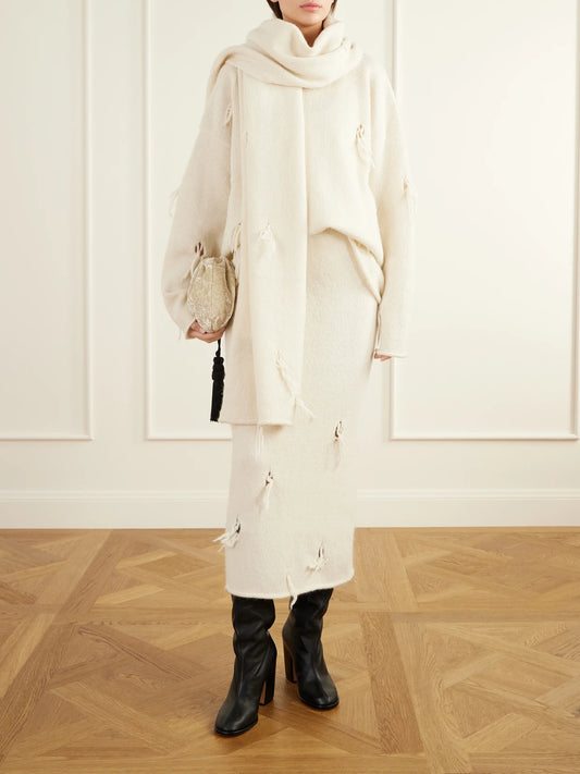 Image of a model wearing Skirts. Product name - Ravel Distressed Wool-blend Midi Skirt in White colour by brand - Lauren Manoogian