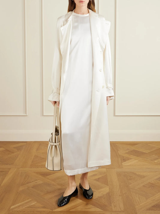 Image of Coats & Jackets. Product name - Double-breasted Draped Satin Trench Coat in Off-white colour by brand - TOTEME