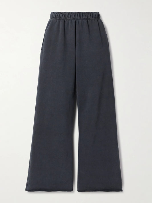 Image of a model wearing Pants. Product name - Cotton-jersey Track Pants in Black colour by brand - SLVRLAKE