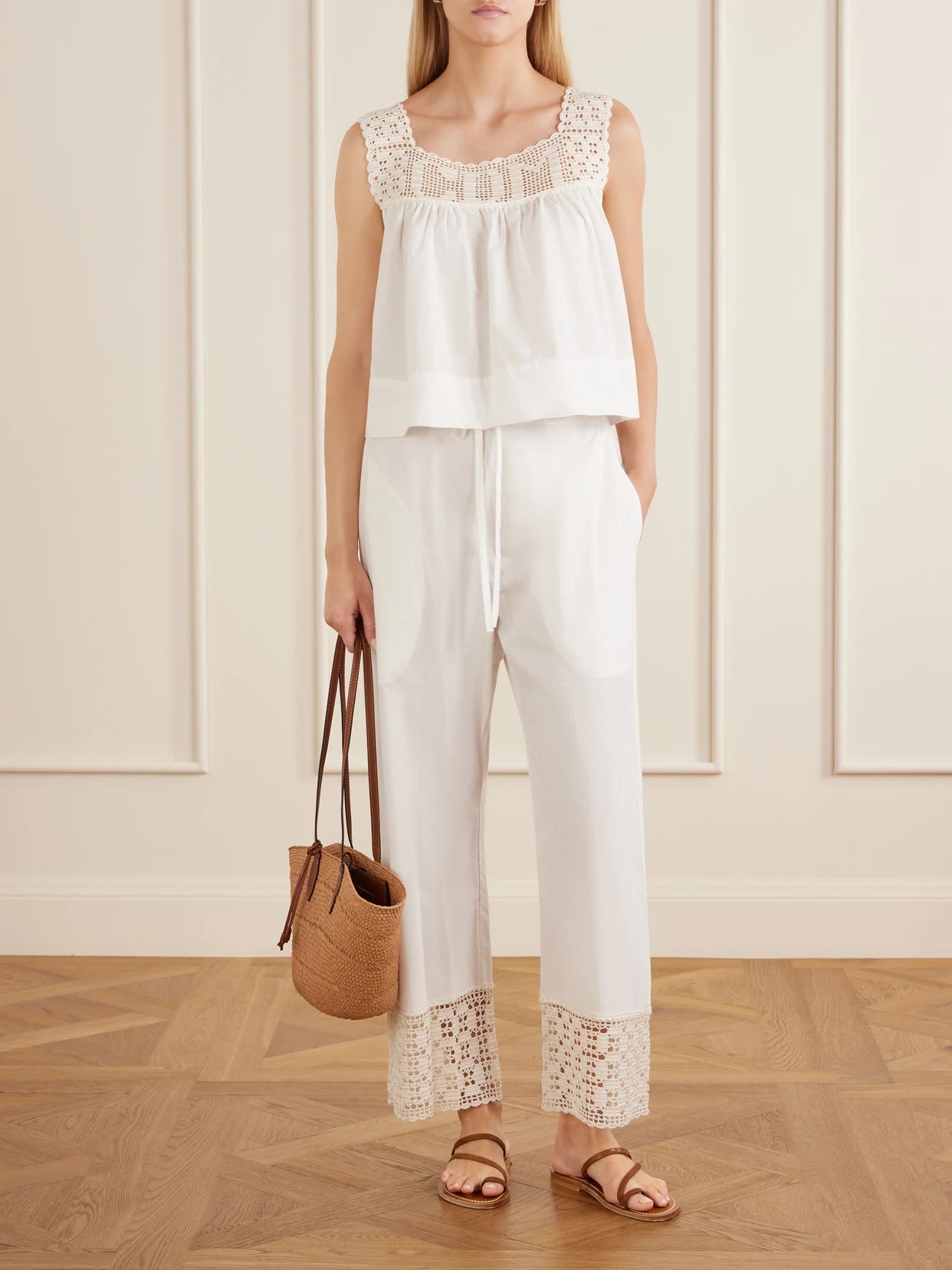 Image of a model wearing Tops. Product name - Heirloom Lace-trimmed Cotton-poplin Top in White colour by brand - Calle Del Mar