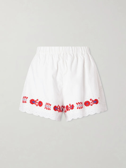 Image of a model wearing Shorts. Product name - Catharina Embroidered Cotton And Linen Shorts in Cream colour by brand - Sea
