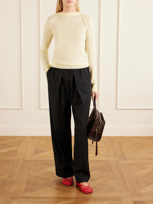 Image of a model wearing Outerwear. Product name - Anagram-embroidered Wool-blend Sweater in Pastel yellow colour by brand - LOEWE