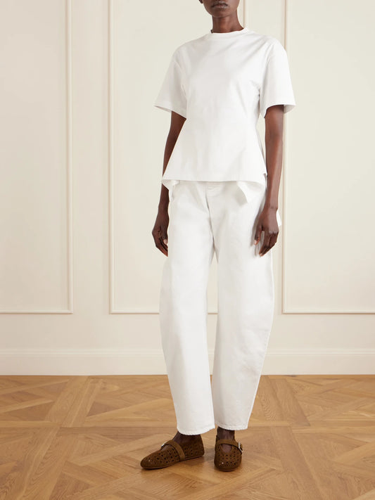 Image of a model wearing Tops. Product name - Pleated Cotton-jersey T-shirt in White colour by brand - Alaïa