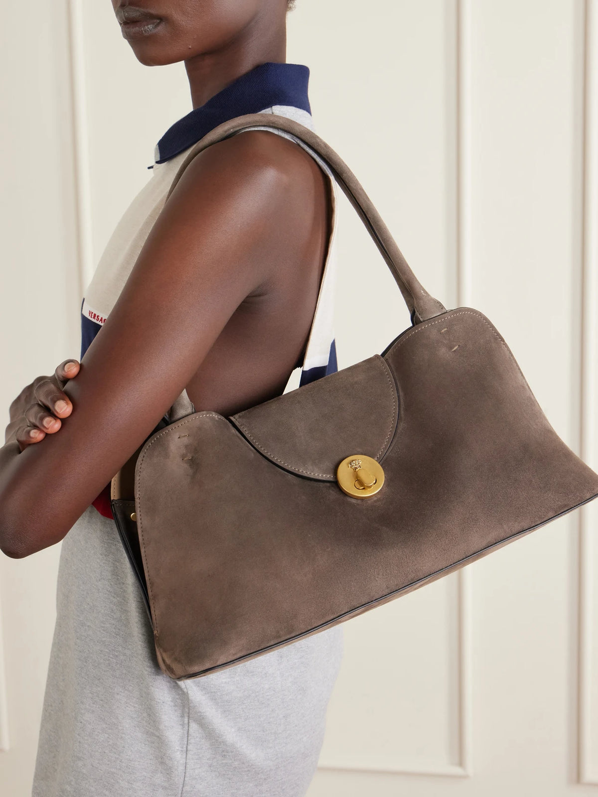 Image of Bags. Product name - Vivienne Logo-embellished Suede Shoulder Bag in Brown colour by brand - Versace