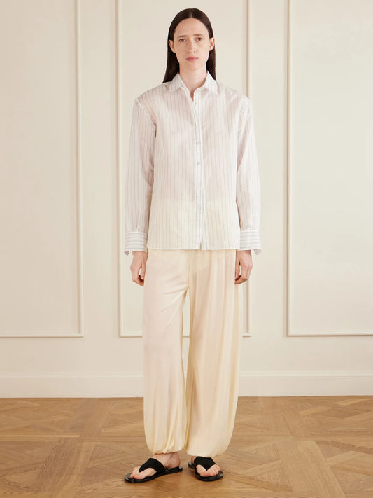 Image of a model wearing Tops. Product name - Brein Striped Cotton And Silk-blend Voile Shirt in Blue colour by brand - AFLALO