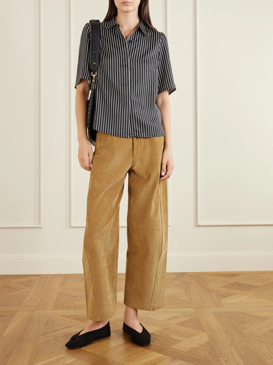 Image of a model wearing Pants. Product name - Crescent Corduroy Organic-cotton Wide-leg Pants in Camel colour by brand - Maria McManus