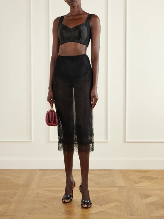 Image of a model wearing Tops. Product name - Cropped Paneled Satin Bustier Top in Black colour by brand - Dolce & Gabbana