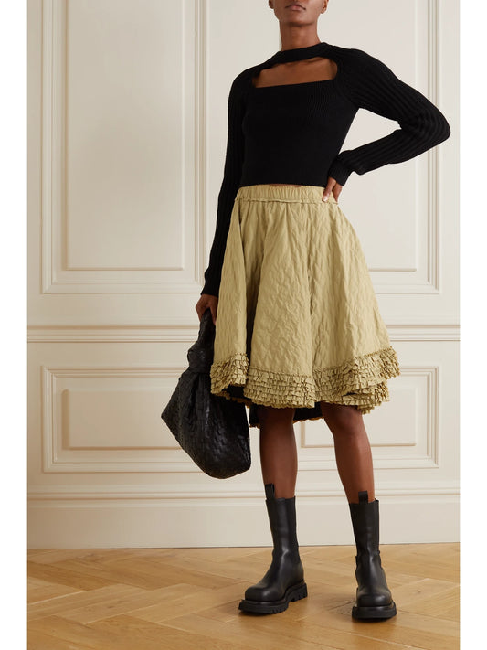 Image of a model wearing Skirts. Product name - + 1952 Ruffled Quilted Shell Skirt in Camel colour by brand - Moncler Genius