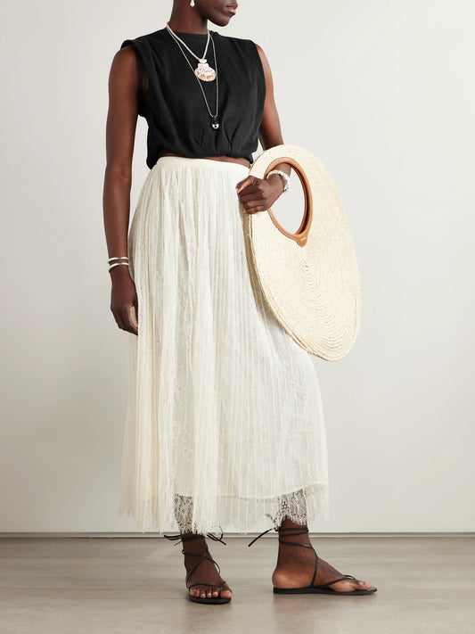 Image of a model wearing Tops. Product name - Muraya Cropped Jersey T-shirt in Black colour by brand - Johanna Ortiz
