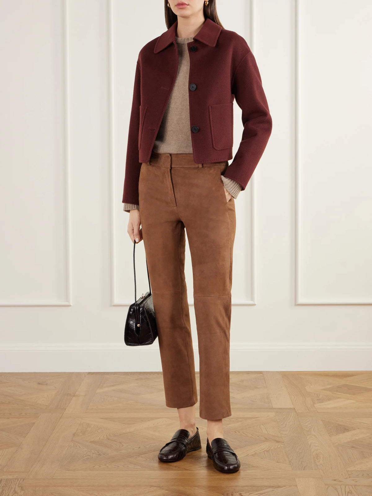 Image of a model wearing Pants. Product name - Jen Paneled Suede Straight-leg Pants in Tan, Black colour by brand - ARMA