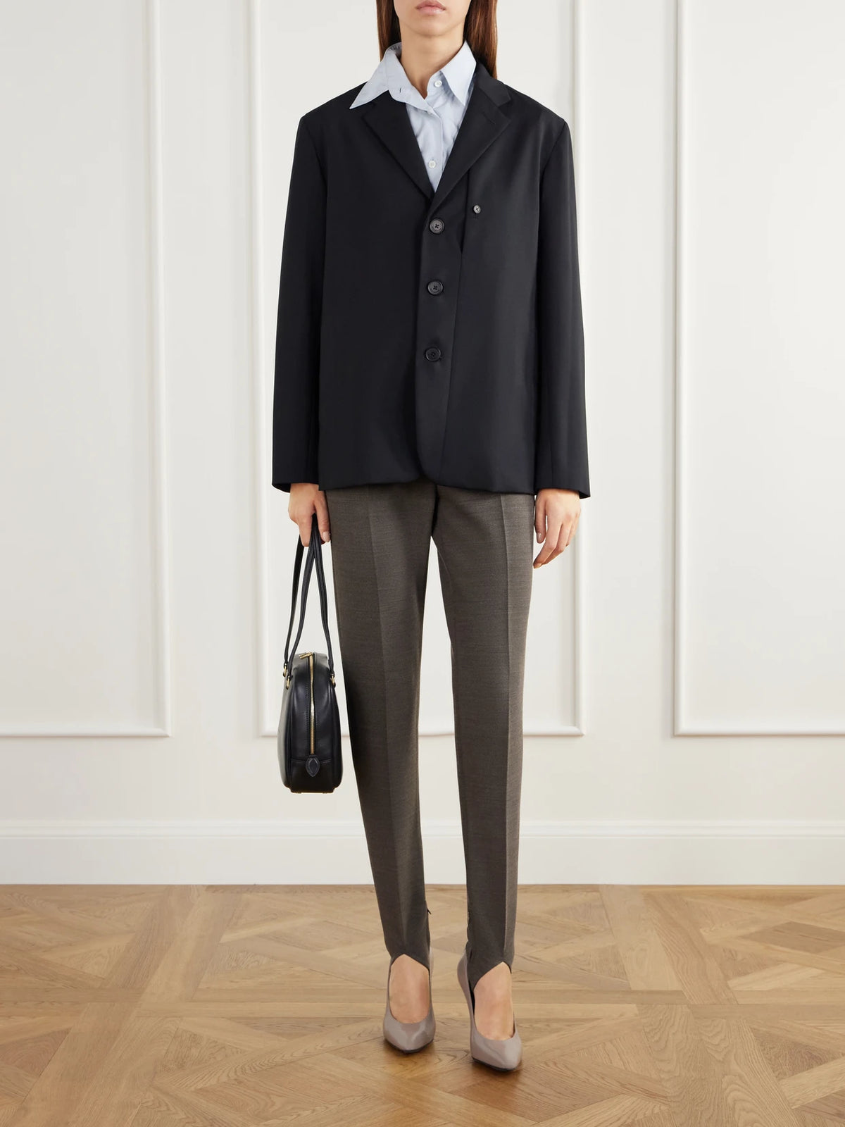 Image of a model wearing Pants. Product name - Wool-blend Stretch-gabardine Straight-leg Stirrup Pants in Gray colour by brand - Jil Sander