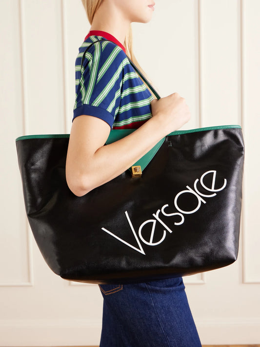 Image of Bags. Product name - Logo-appliquéd Leather-trimmed Coated-canvas Tote in Black colour by brand - Versace
