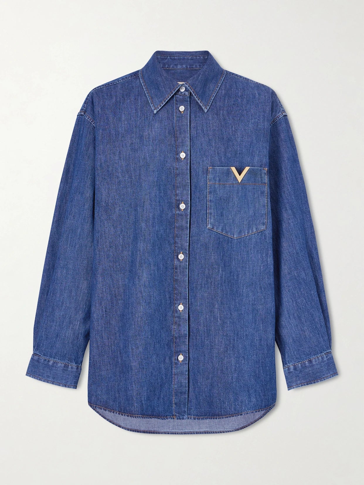 Image of a model wearing Tops. Product name - Embellished Cotton-denim Shirt in Dark denim colour by brand - Valentino Garavani
