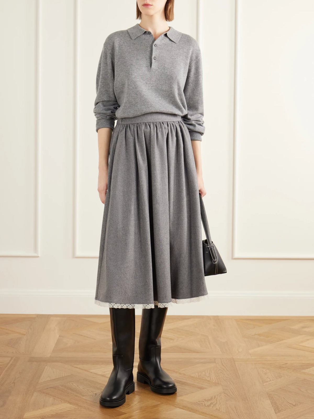 Image of a model wearing Skirts. Product name - Gathered Lace-trimmed Wool-blend Flannel Midi Skirt in Gray colour by brand - Maria McManus
