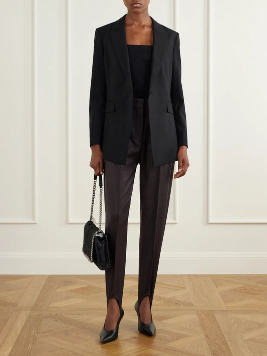 Image of a model wearing Pants. Product name - Tapered Wool-flannel Stirrup Pants in Dark brown colour by brand - Stella McCartney