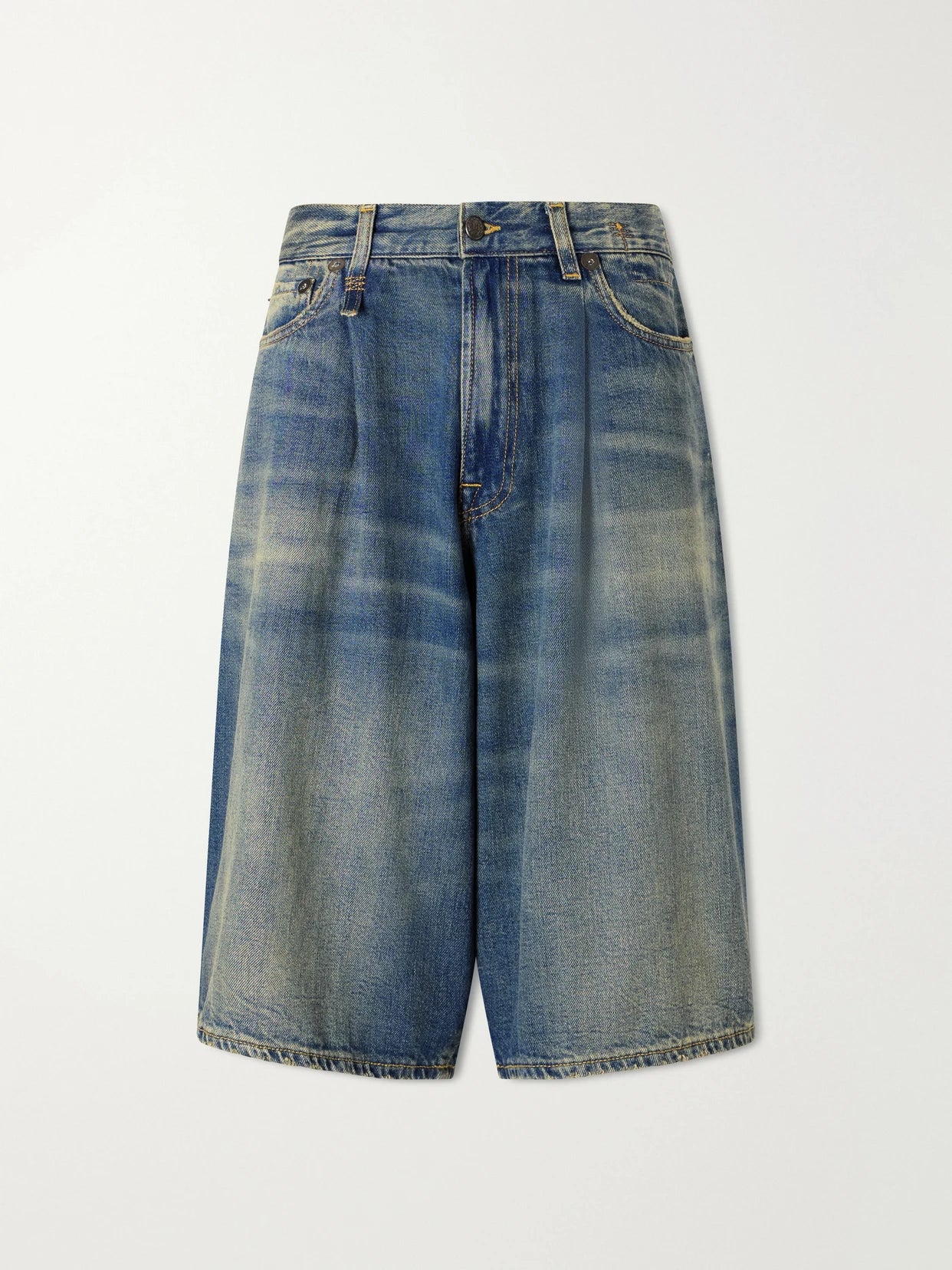 Image of a model wearing Shorts. Product name - Jesse Denim Shorts in Mid denim colour by brand - R13