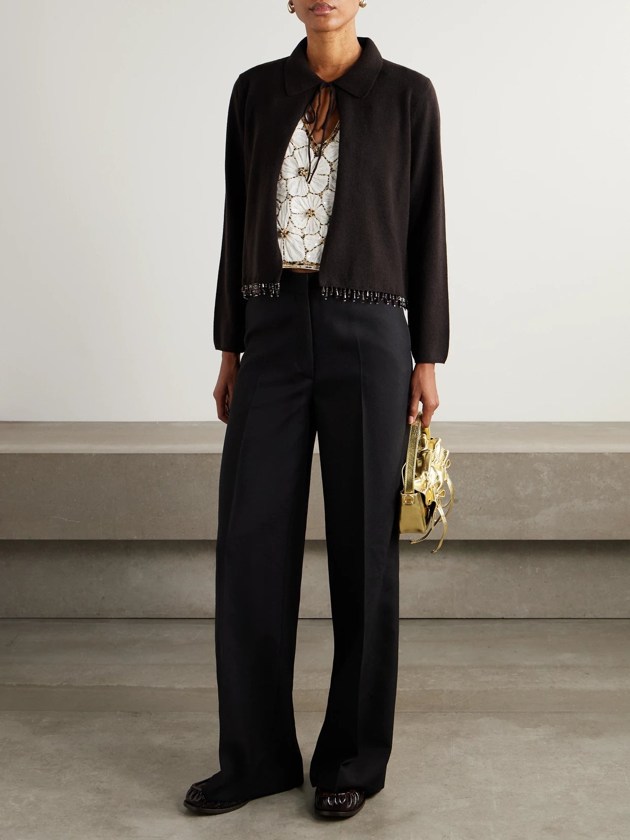 Image of a model wearing Outerwear. Product name - Embellished Wool And Cashmere-blend Cardigan in Dark brown colour by brand - BODE