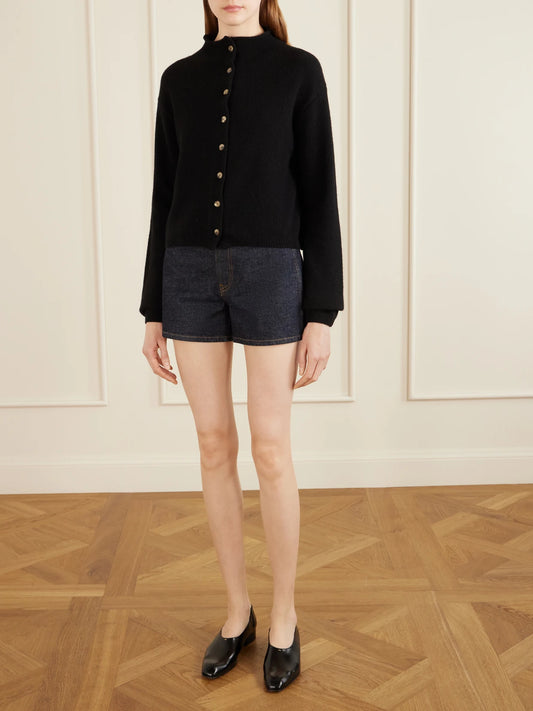 Image of a model wearing Shorts. Product name - Danya Straight-leg Denim Shorts in Dark denim colour by brand - KHAITE
