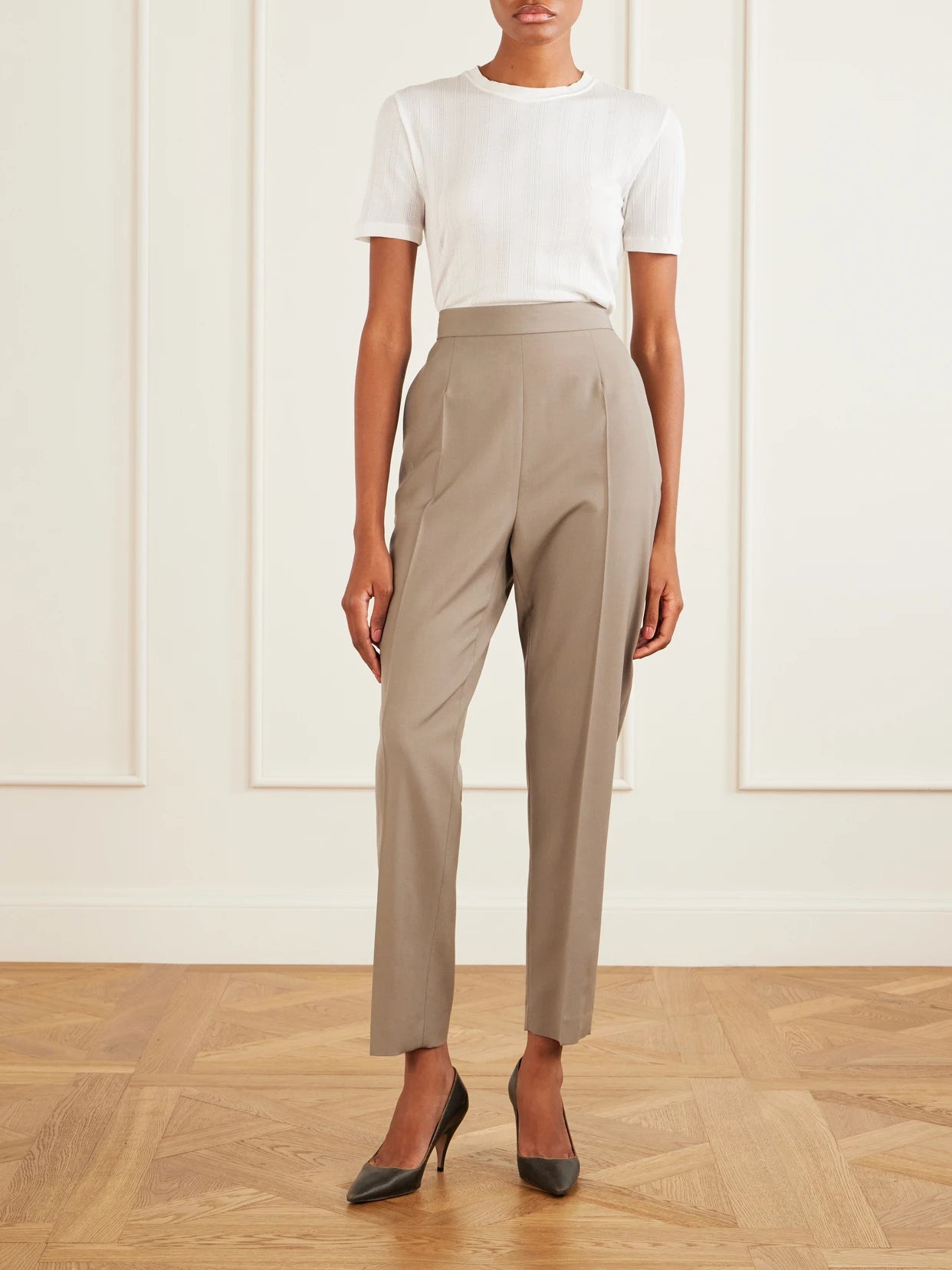 Image of a model wearing Pants. Product name - Eranza Wool Straight-leg Pants in Gray colour by brand - The Row