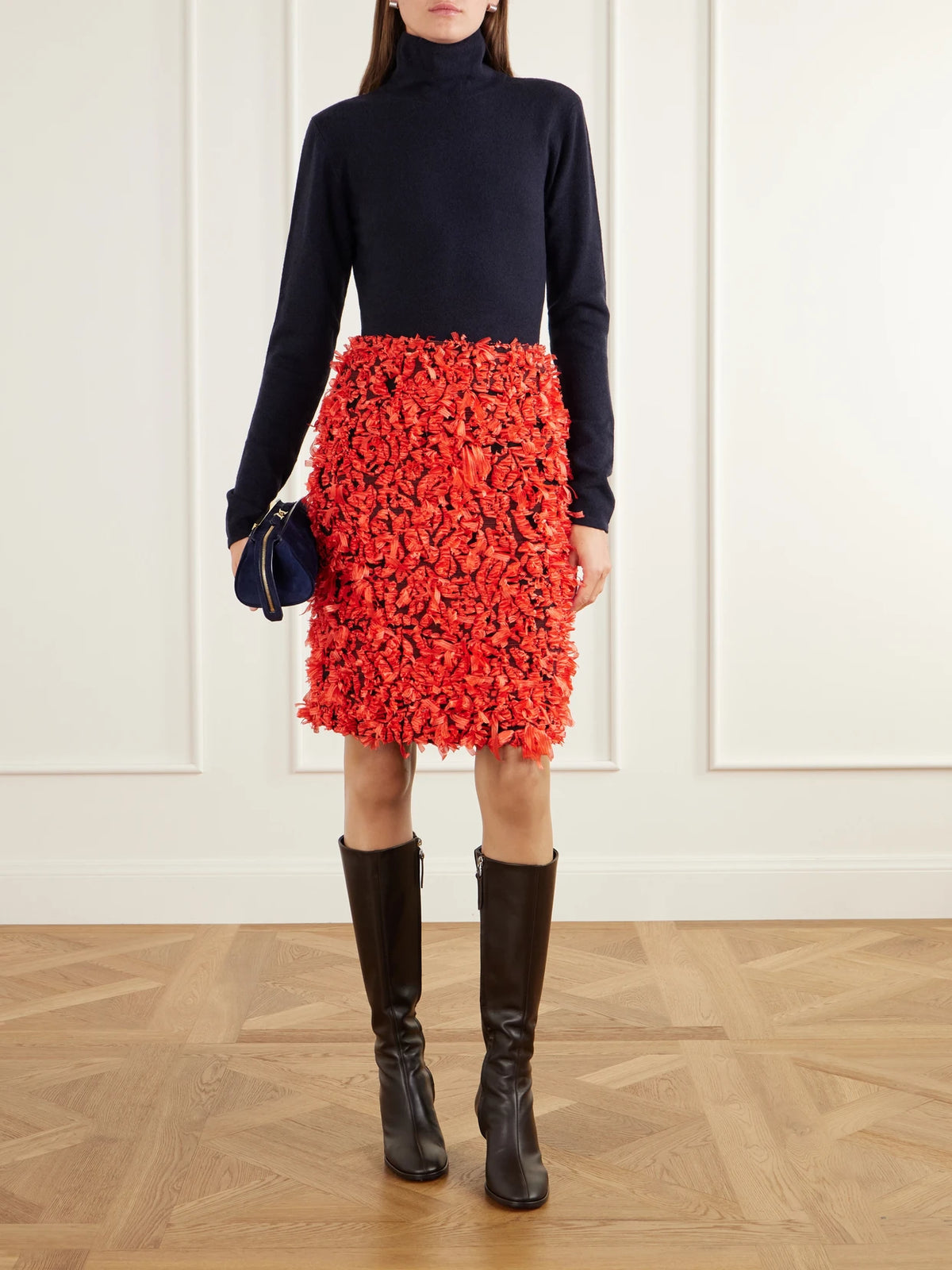 Image of a model wearing Skirts. Product name - Renaud Fil-coupé Mini Skirt in Red colour by brand - TOVE