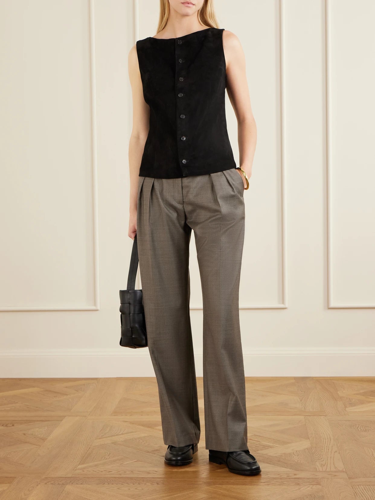 Image of a model wearing Tops. Product name - Mae Suede Vest in Black colour by brand - STOULS
