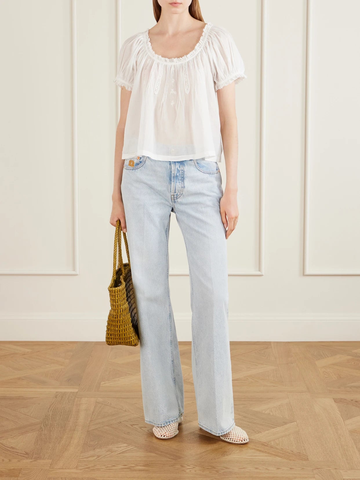 Image of a model wearing Tops. Product name - Frederica Organic Cotton-voile Blouse in White colour by brand - DÔEN