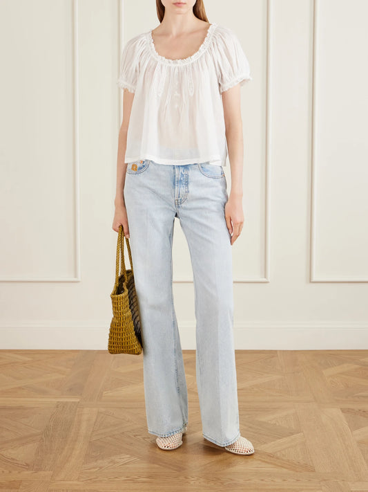 Image of a model wearing Tops. Product name - Frederica Organic Cotton-voile Blouse in White colour by brand - DÔEN