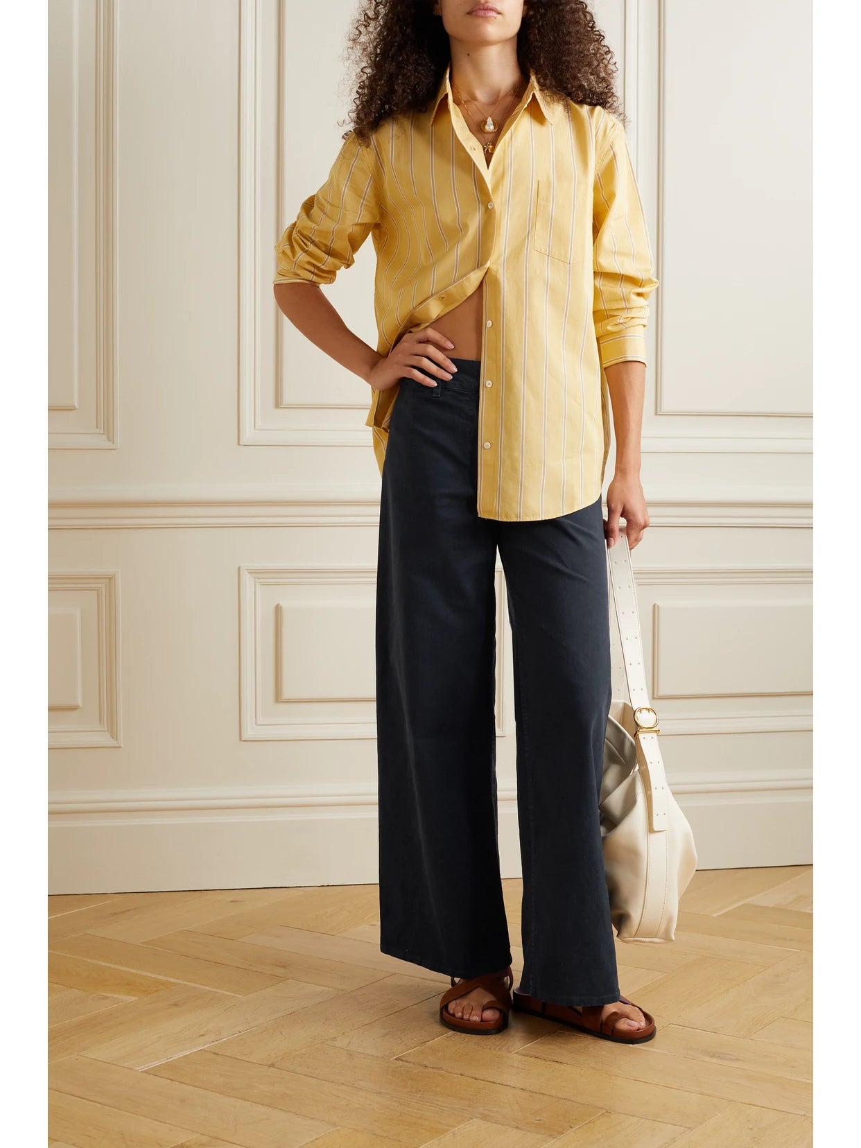 Image of a model wearing Pants. Product name - Megan Cotton-blend Twill Wide-leg Pants in Midnight blue colour by brand - Nili Lotan