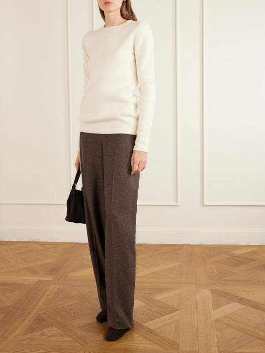 Image of a model wearing Outerwear. Product name - Silk, Alpaca And Cashmere-blend Sweater in Ecru colour by brand - TOTEME