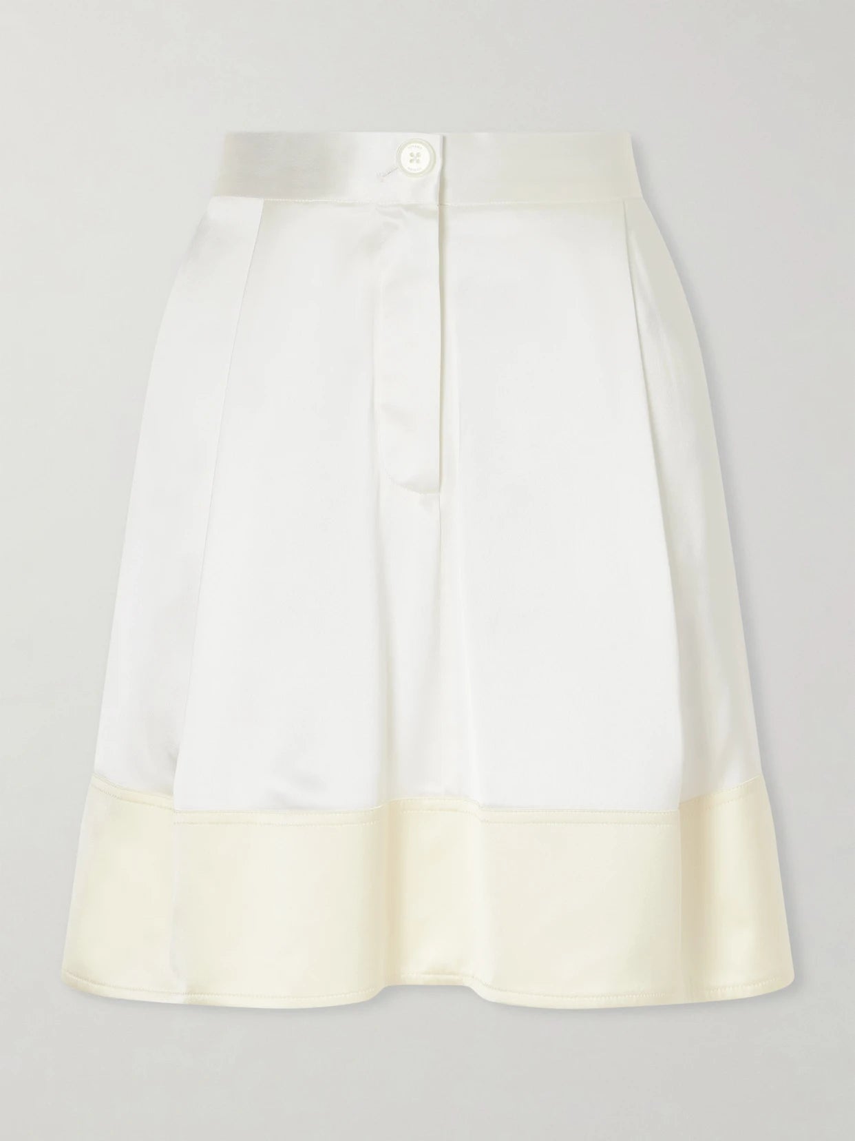 Image of a model wearing Skirts. Product name - Satin Mini Skirt in White colour by brand - TOTEME