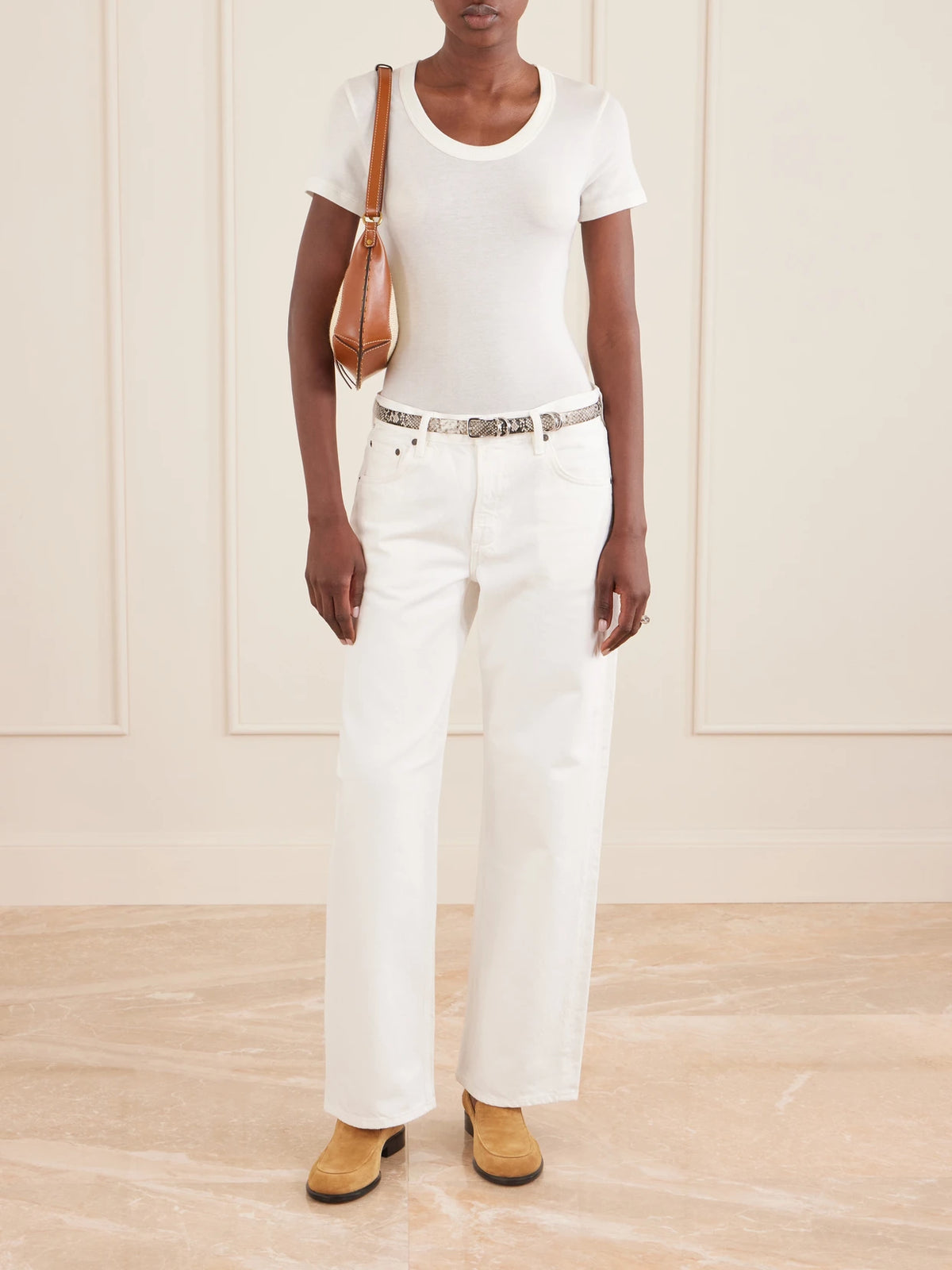 Image of a model wearing Tops. Product name - Maude Jersey T-shirt in Cream colour by brand - Citizens of Humanity