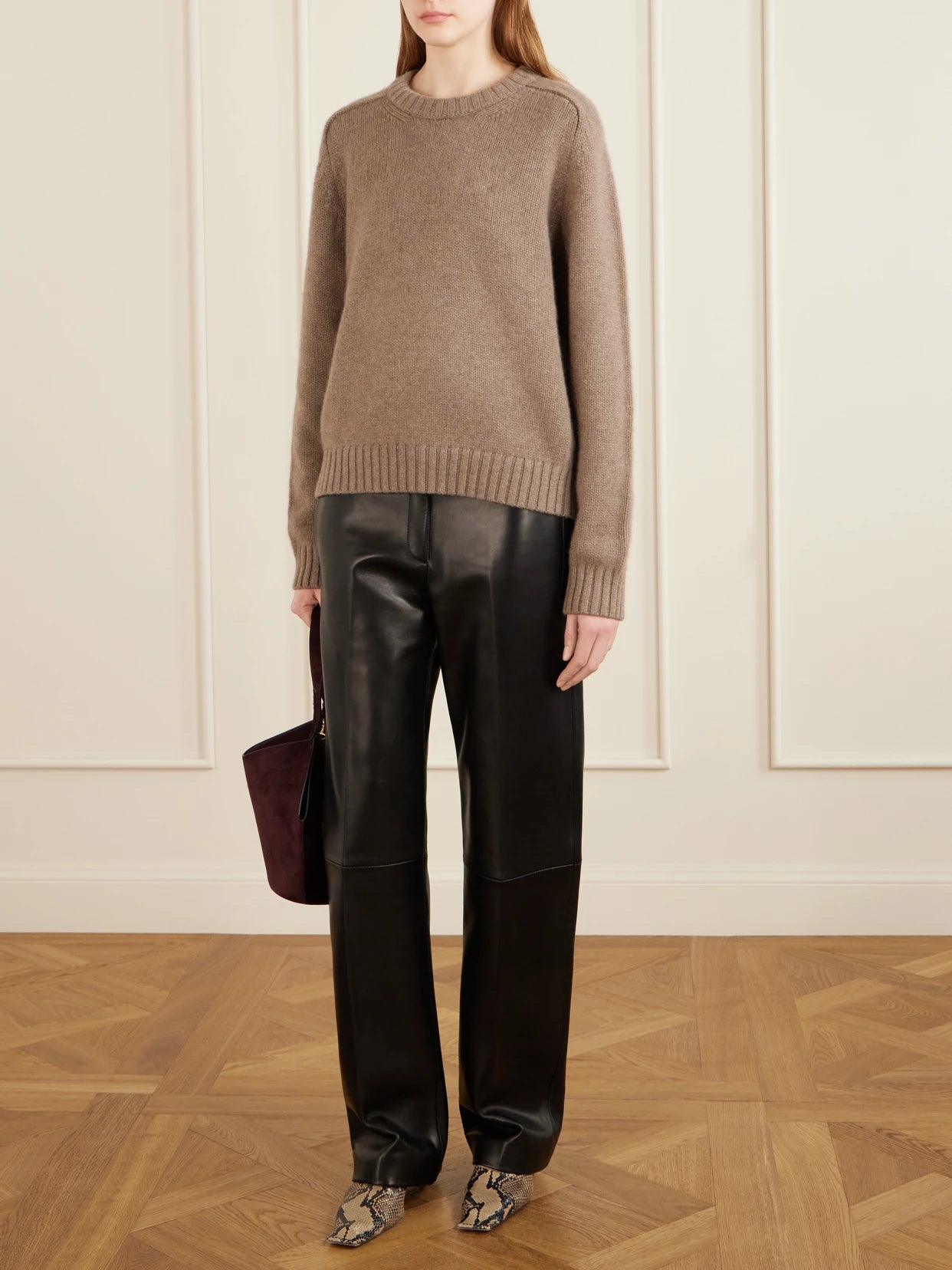 Image of a model wearing Outerwear. Product name - Mae Cashmere Sweater in Brown colour by brand - KHAITE