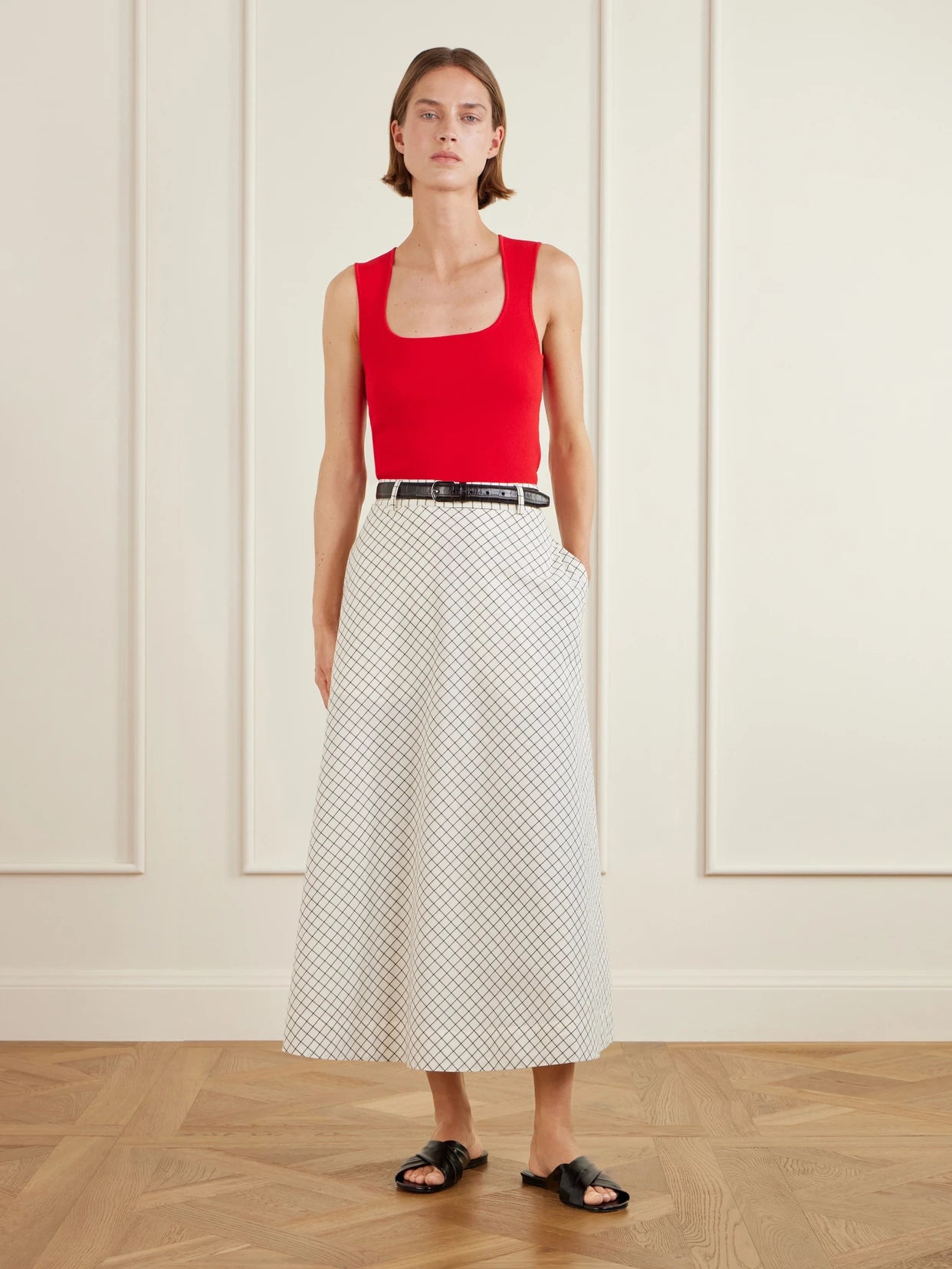 Image of a model wearing Skirts. Product name - Checked Cotton-blend Poplin Midi Skirt in Multi colour by brand - RÓHE