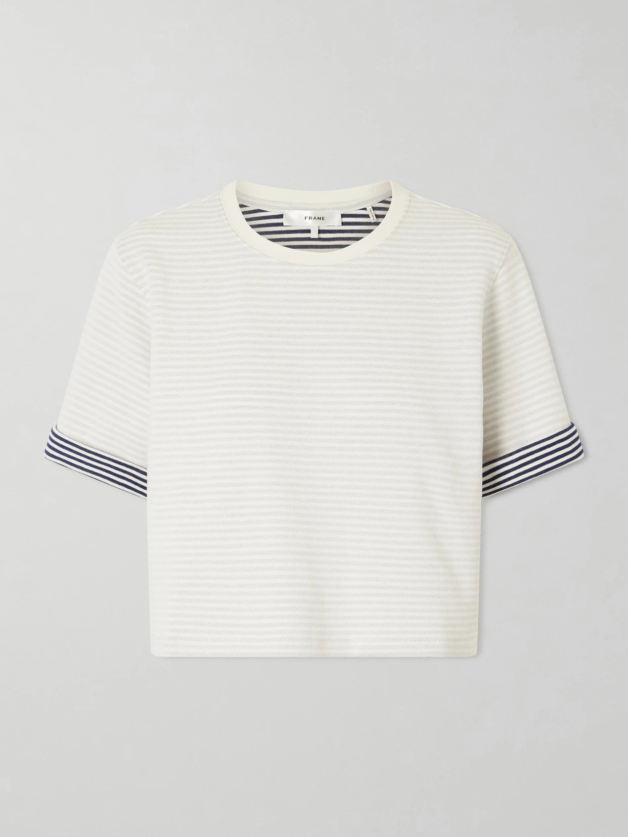 Image of a model wearing Tops. Product name - Striped Cuff Pima Cotton T-shirt in Cream colour by brand - FRAME