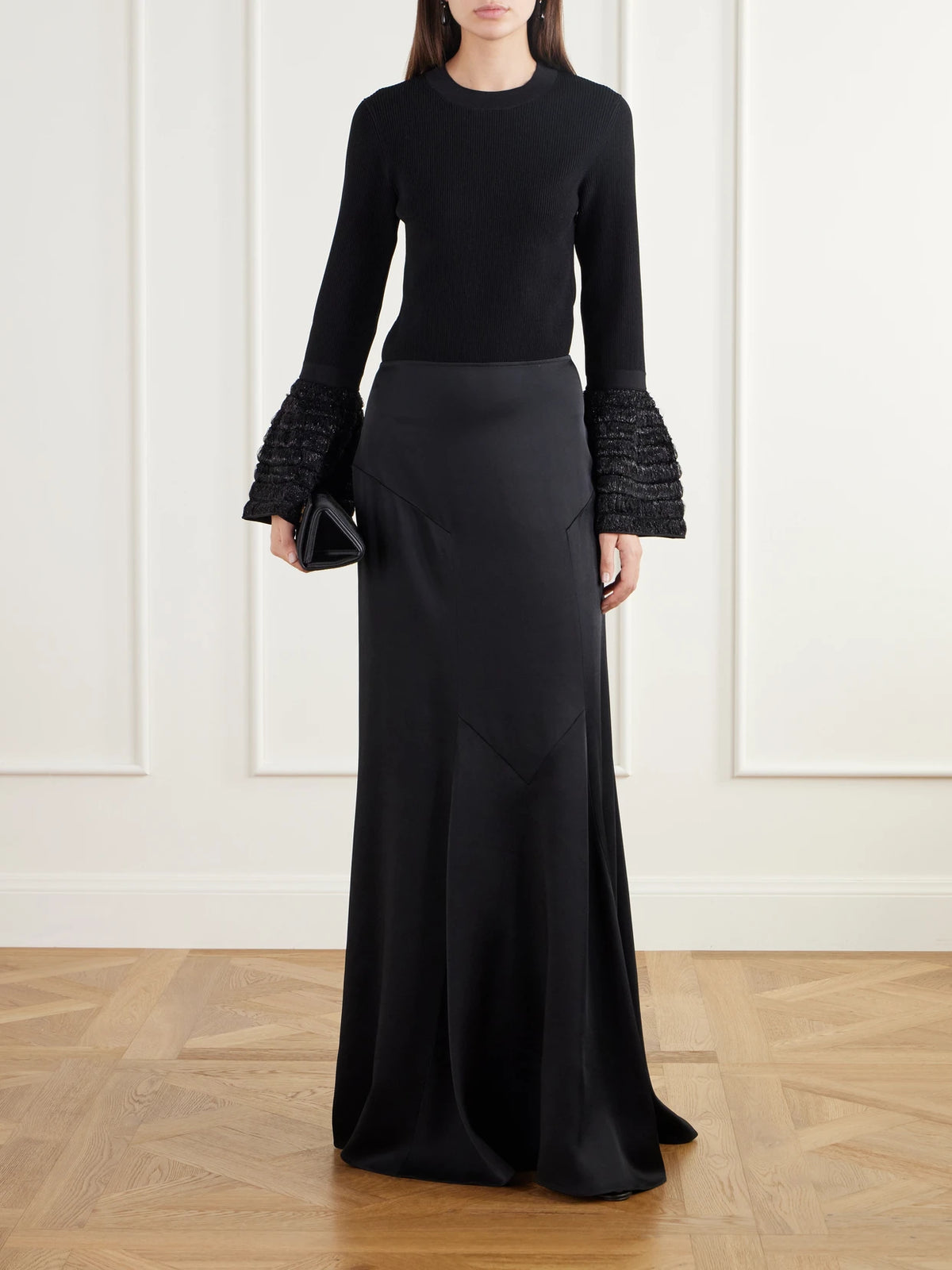 Image of a model wearing Skirts. Product name - Paneled Satin Maxi Skirt in Black colour by brand - Stella McCartney