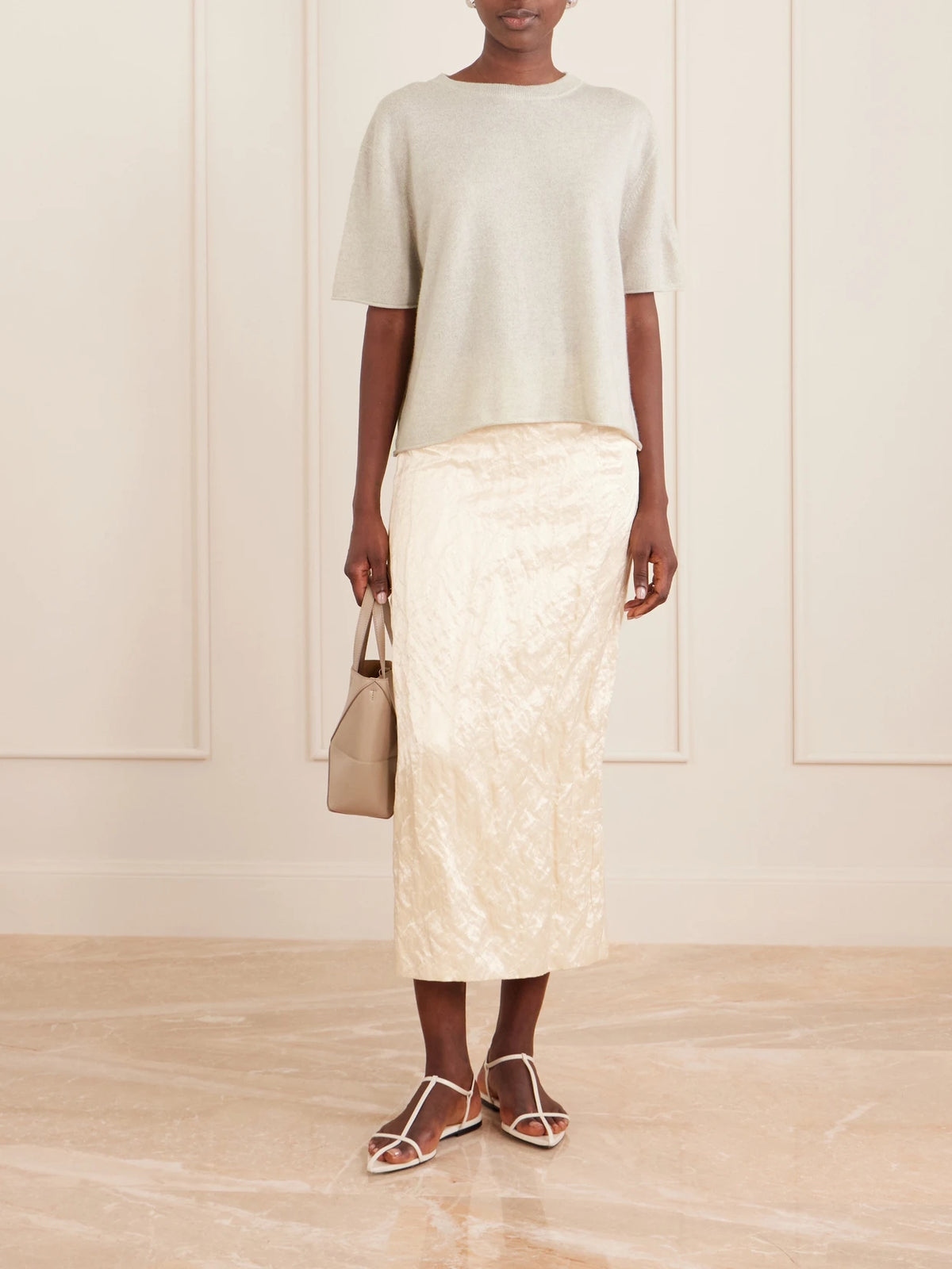Image of a model wearing Tops. Product name - Cila Cashmere T-shirt in Beige colour by brand - LISA YANG