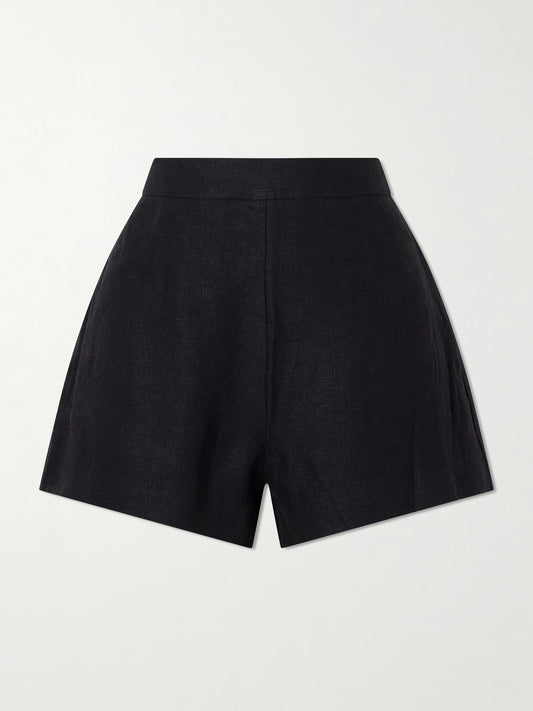 Image of a model wearing Shorts. Product name - Perri Pleated Linen Shorts in Black colour by brand - Posse