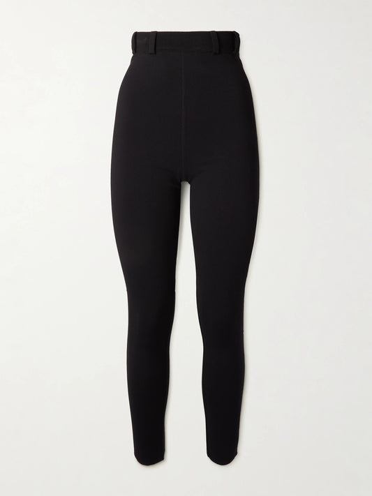 Image of a model wearing Pants. Product name - Stretch-knit Leggings in Black colour by brand - Alaïa
