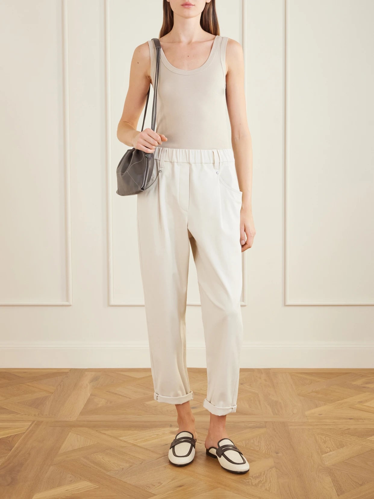 Image of a model wearing Tops. Product name - Ribbed Cotton-blend Jersey Tank in Beige colour by brand - Brunello Cucinelli