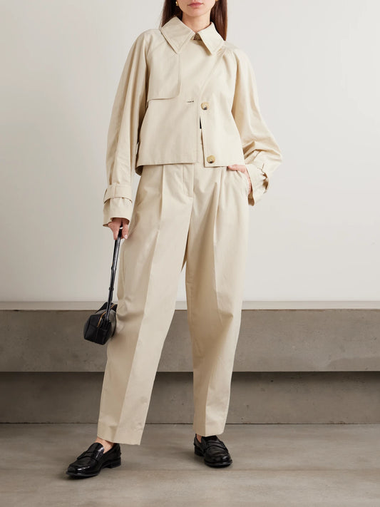 Image of a model wearing Pants. Product name - Paver Cotton-gauze Tapered Pants in Off-white colour by brand - Joseph