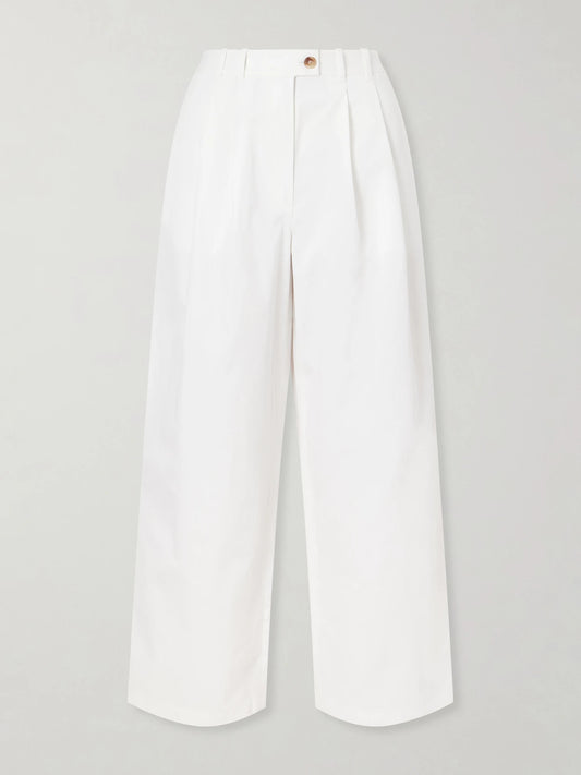Image of a model wearing Pants. Product name - Lisa Pleated Cotton-twill Wide-leg Pants in White colour by brand - DÔEN