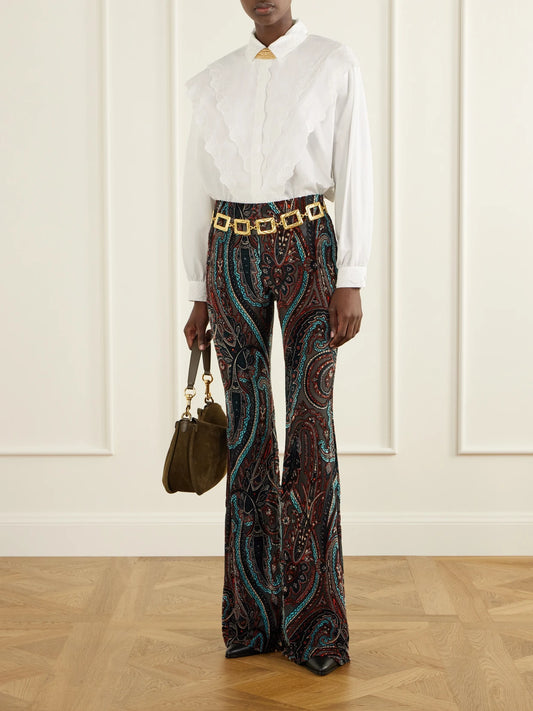 Image of a model wearing Pants. Product name - Paisley-appliquéd Mesh Flared Pants in Brown colour by brand - Etro
