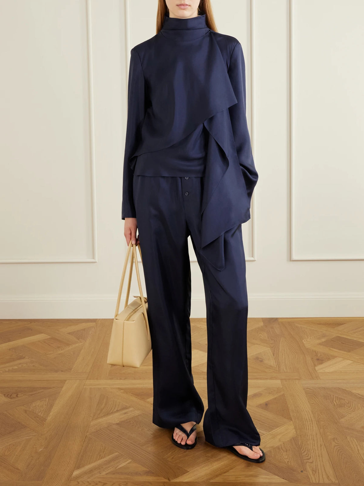 Image of a model wearing Tops. Product name - Scarf-detailed Silk-satin Blouse in Navy colour by brand - RÓHE